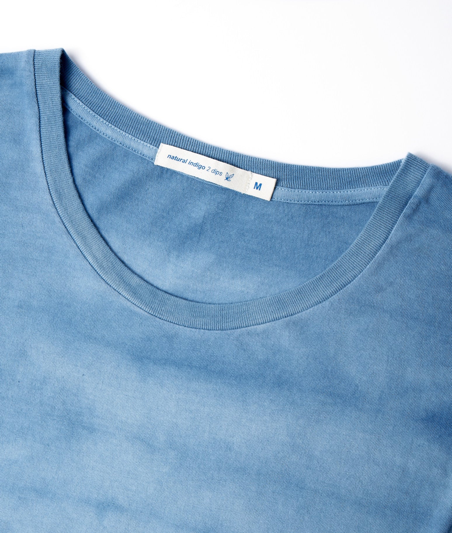 A close up of a blue t - shirt.
