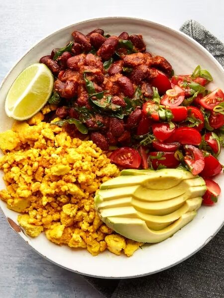 A plate of chili, scramble, and a tomato and avocado salad made from Mindful Chef's meal delivery service.