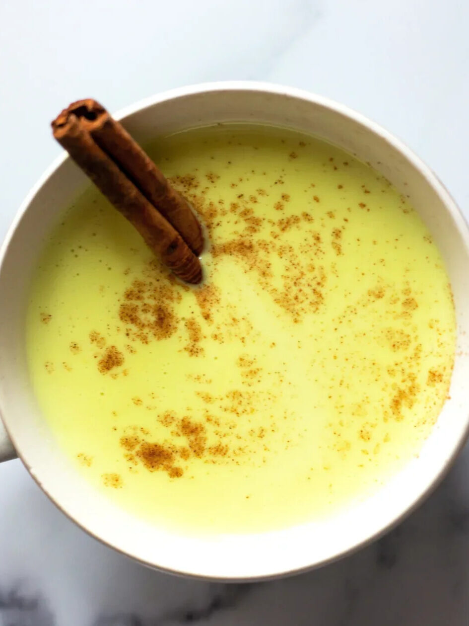 A close up shot of a turmeric latte made with Needed. collagen protein. 