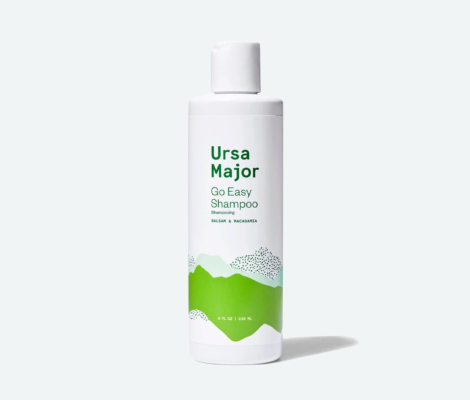 Bottle of ursa major go easy shampoo on a white background.