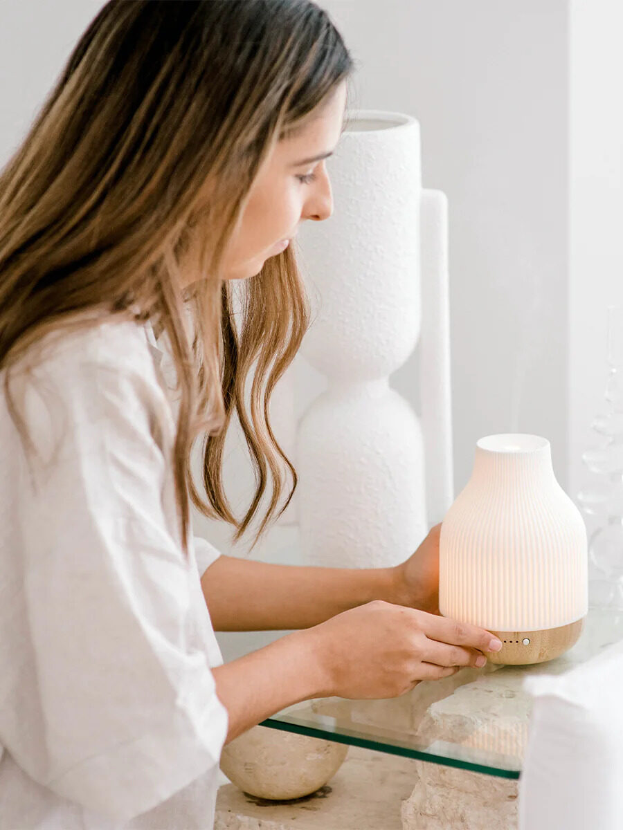 A model turning on an ECO. diffuser. 