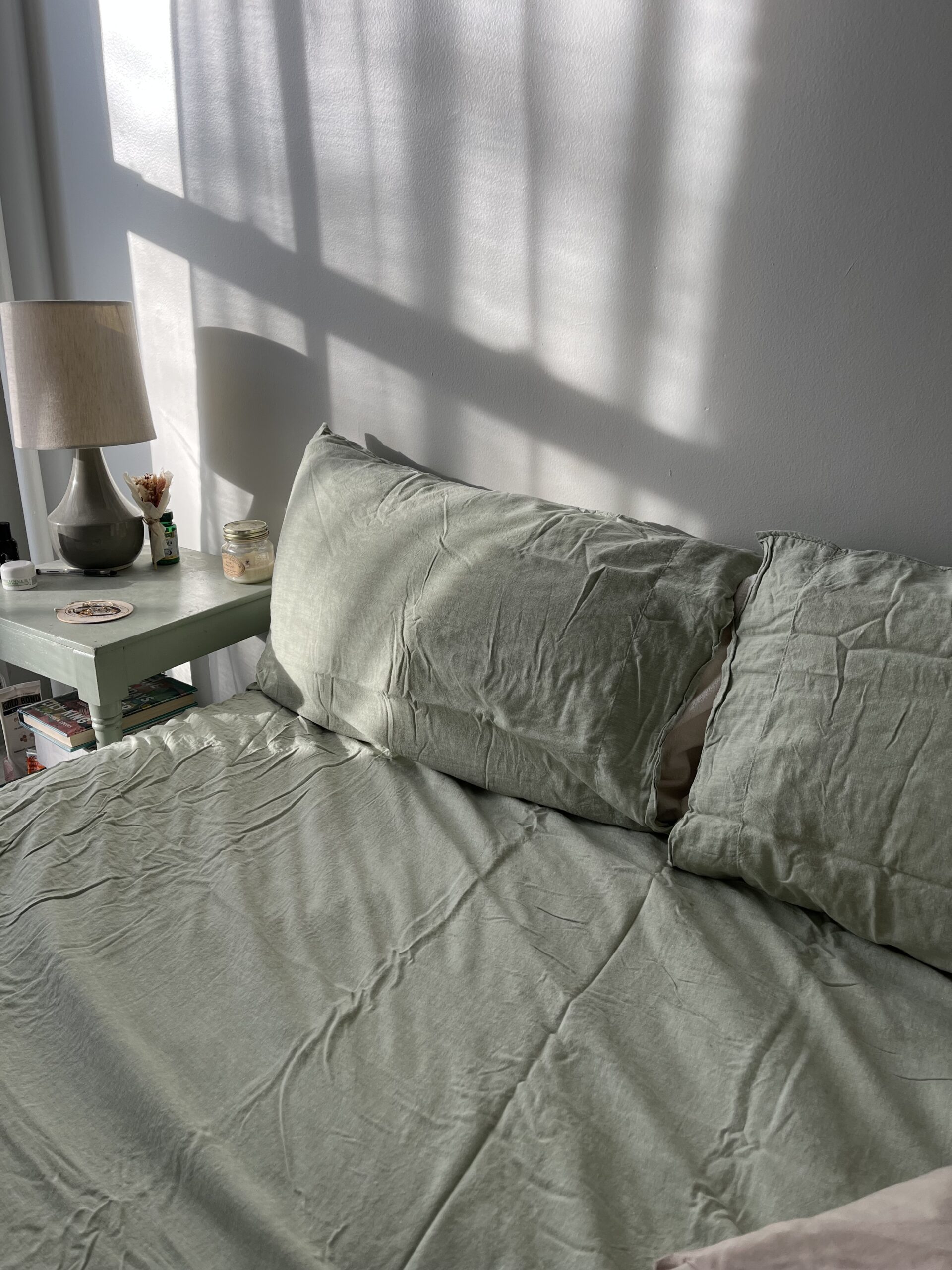 The author's bed made up in Under the Canopy eucalyptus linen sheets.