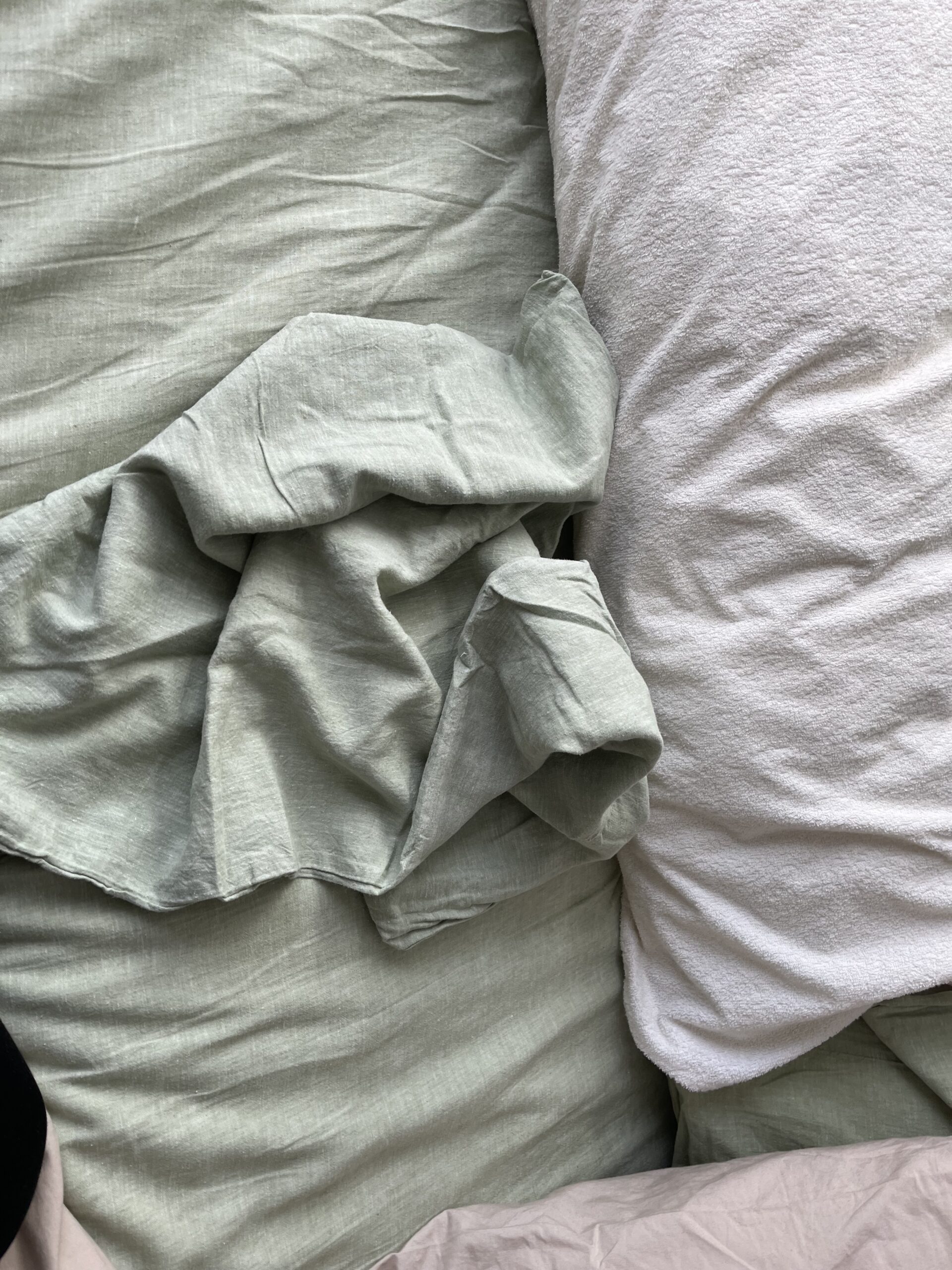 The author's bed made up in Under the Canopy eucalyptus linen sheets.