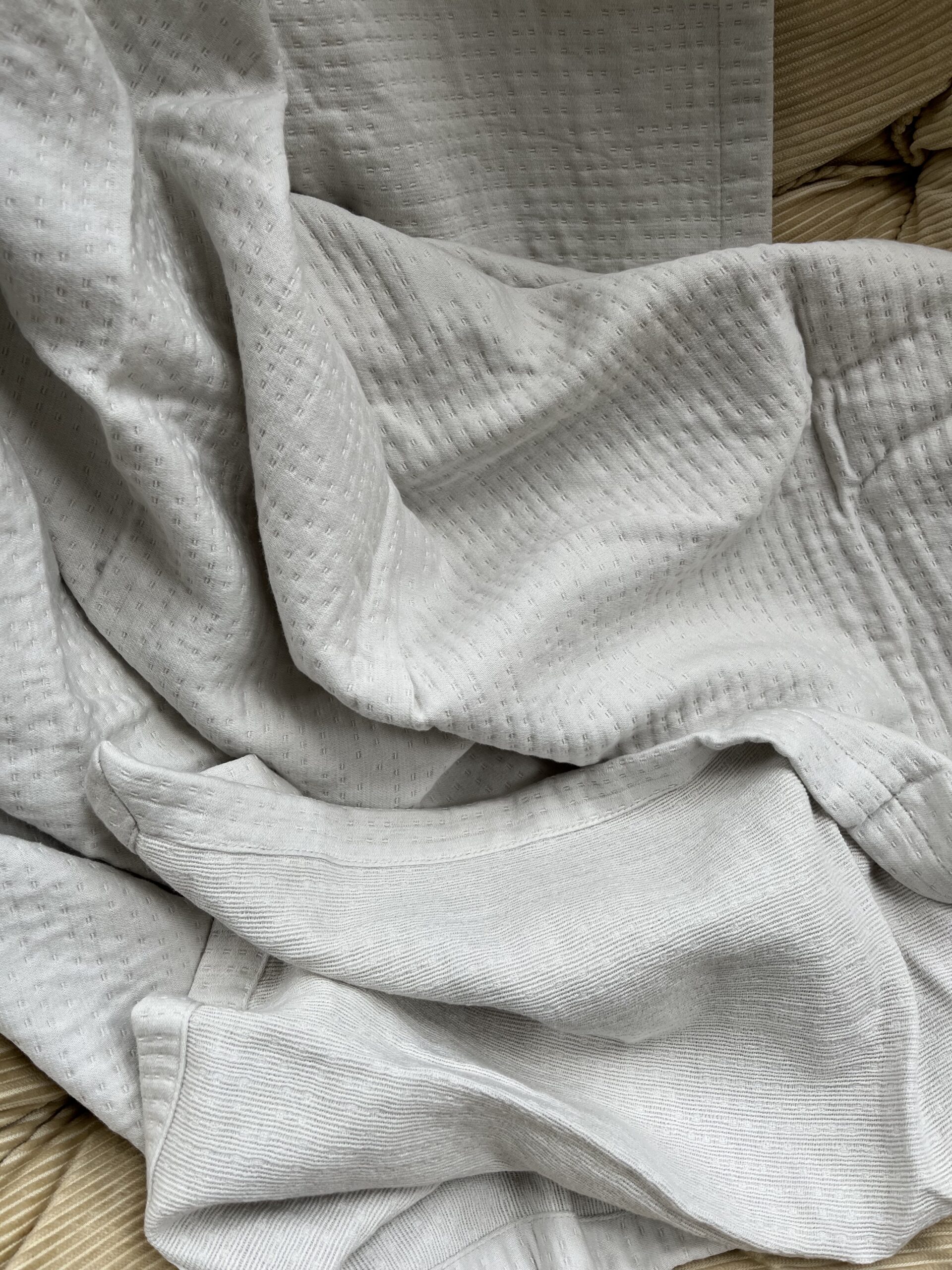 The organic Matelassé blanket from Under the canopy in the author's home. 