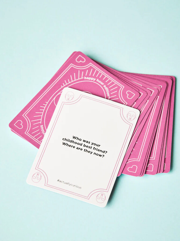 A set of pink playing cards on a blue background.