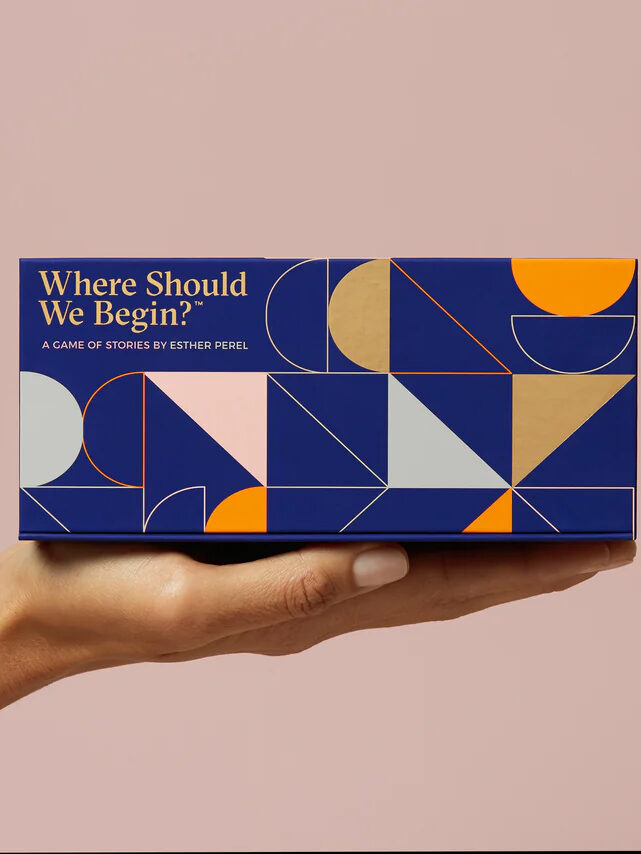 A hand holding a box that says Where Should We Begin?.