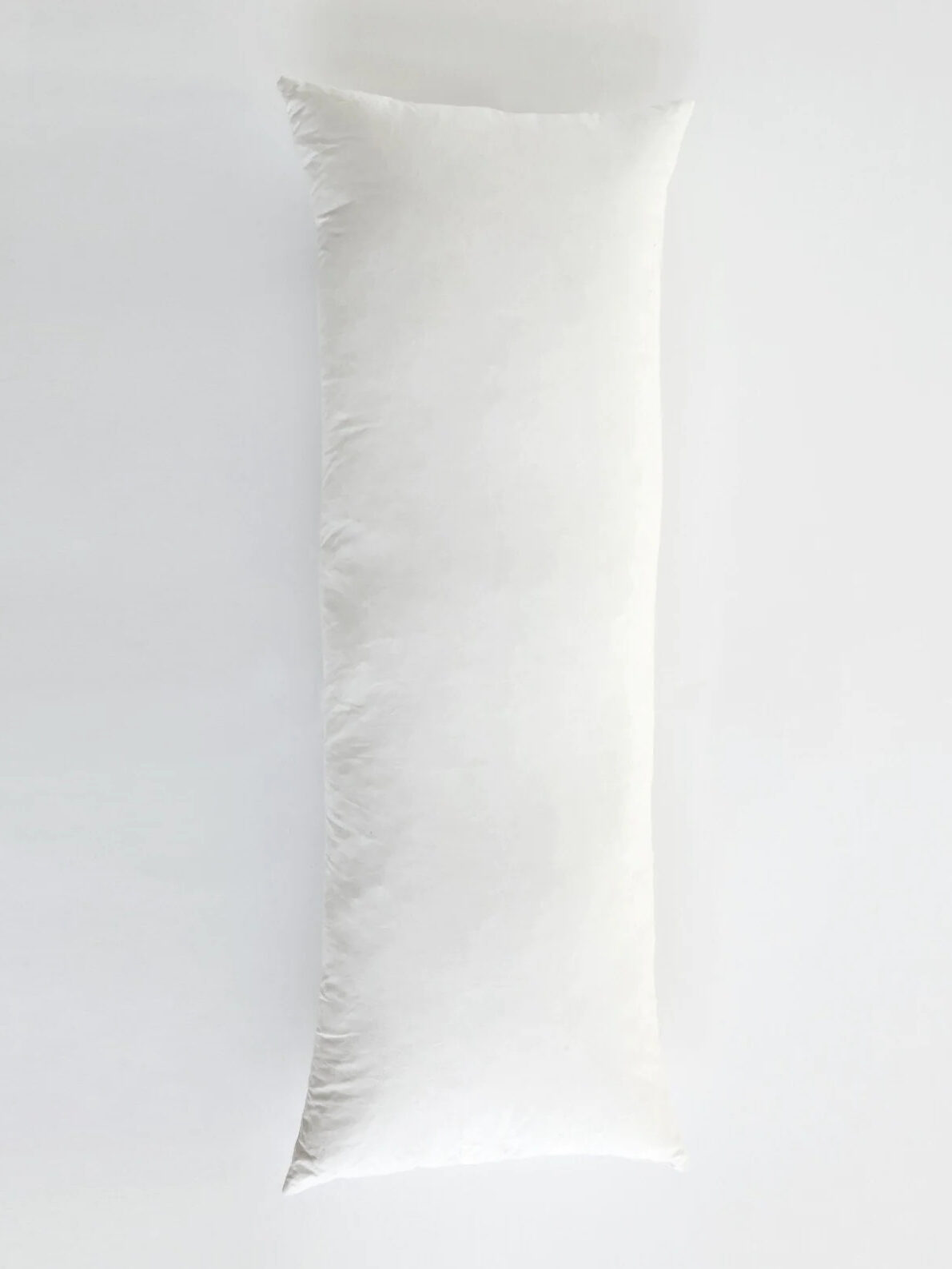 A white pillow on a white background.