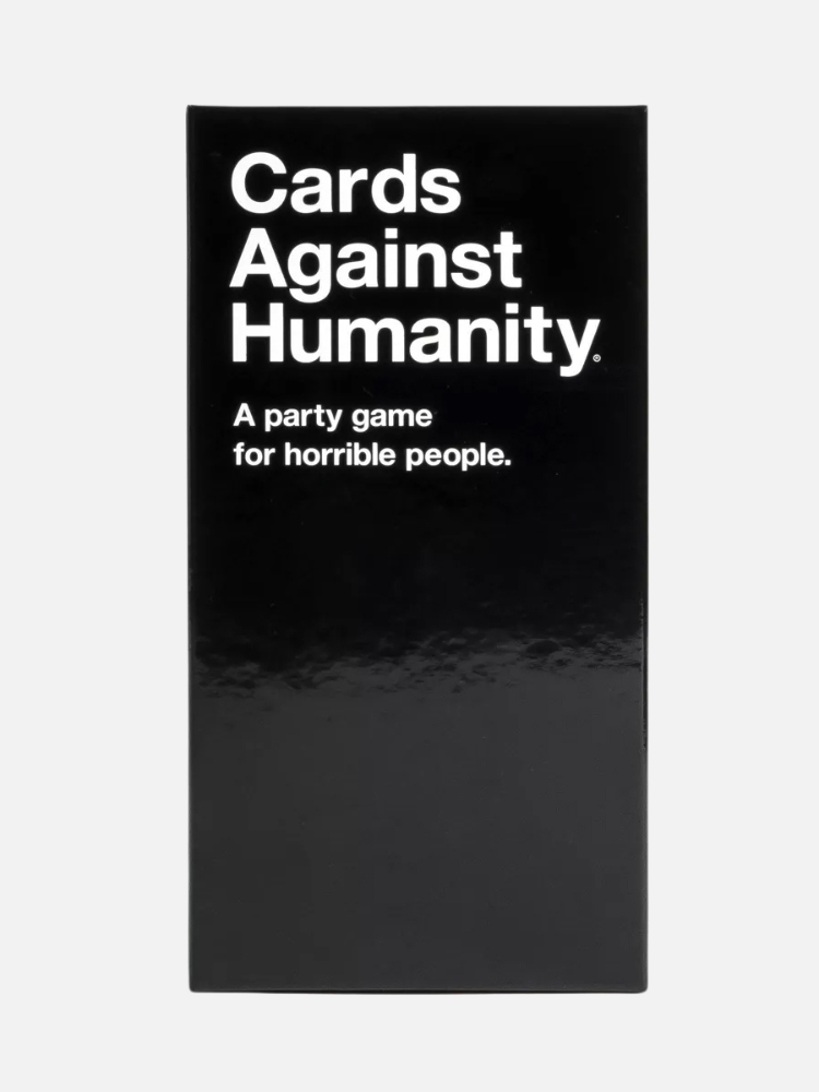 A boxed set of "cards against humanity," a party game, against a white background.