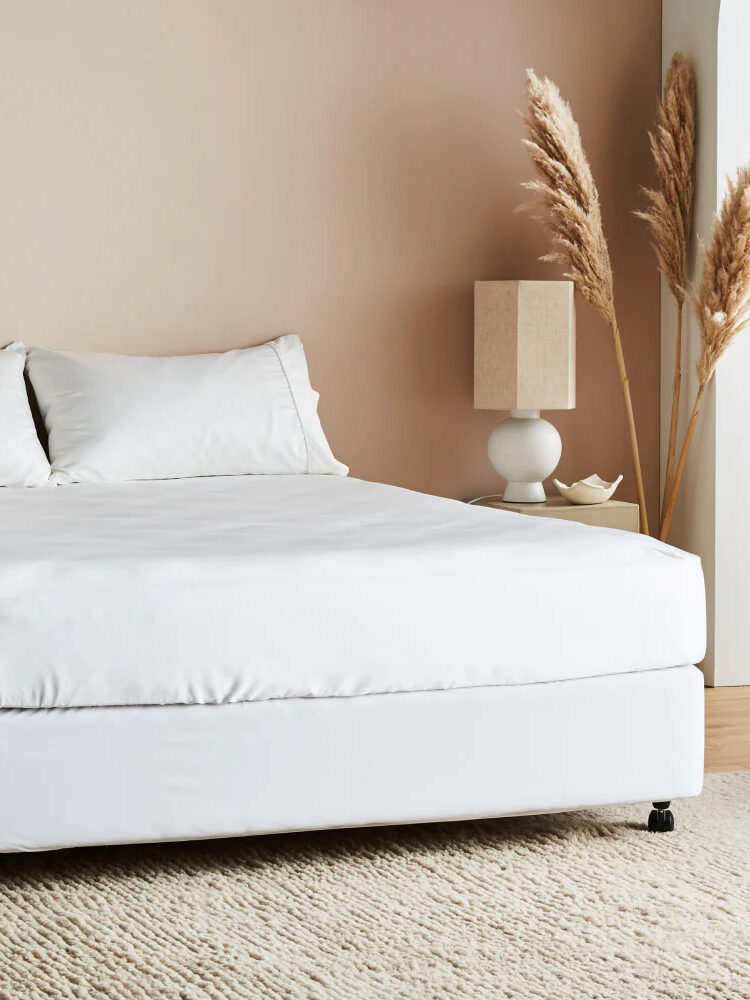 Ettitude white bamboo sheets on a bed.
