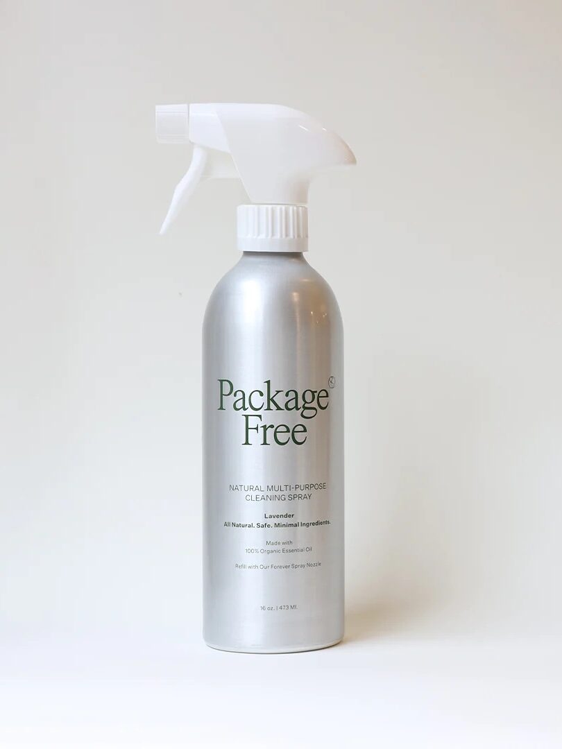 A spray bottle of package free natural multi-purpose cleaner against a plain background.