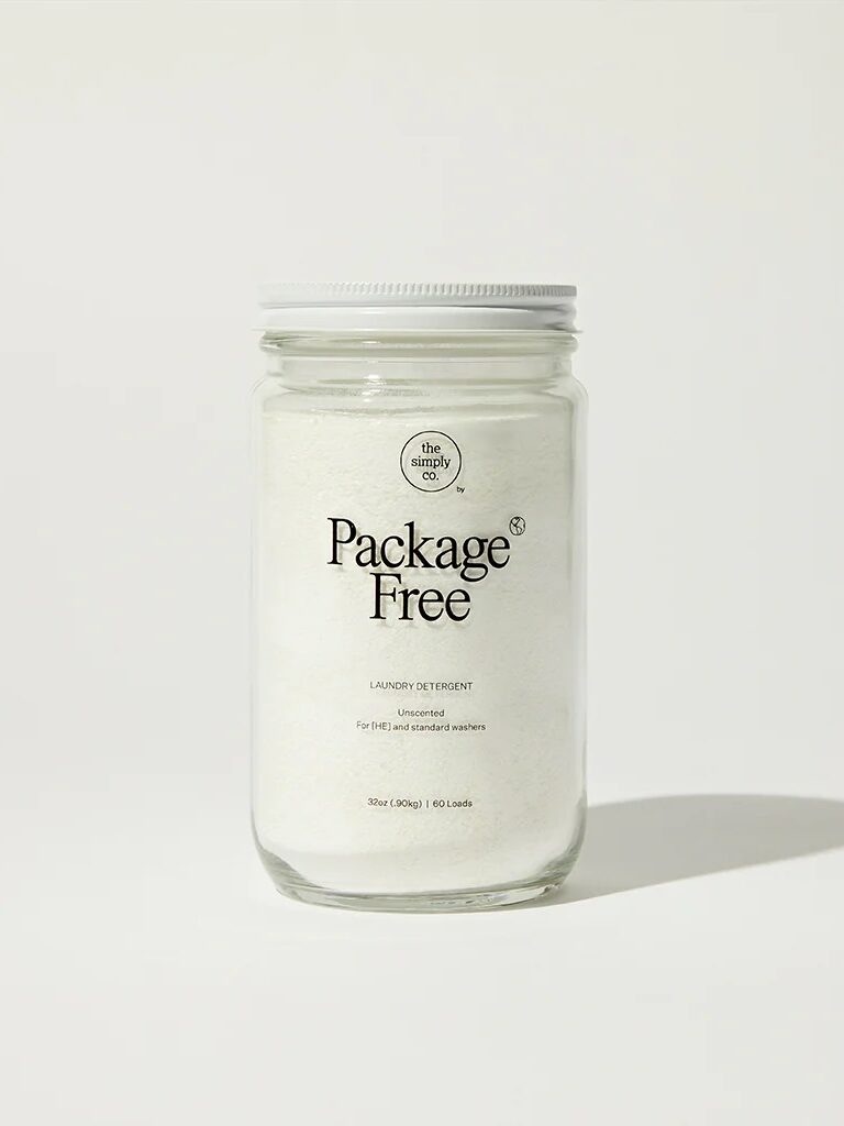 Glass jar containing package-free laundry detergent against a white background.