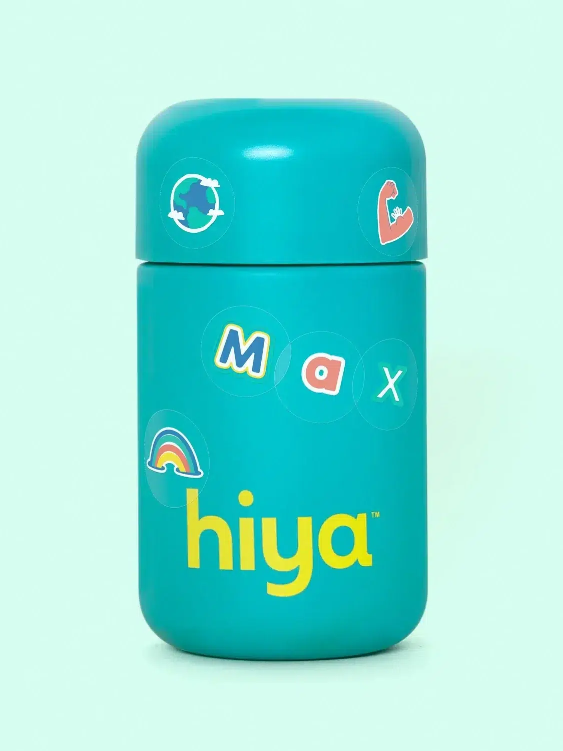 A turquoise children's insulated bottle with stickers and the name "hiya" on it against a light green background.