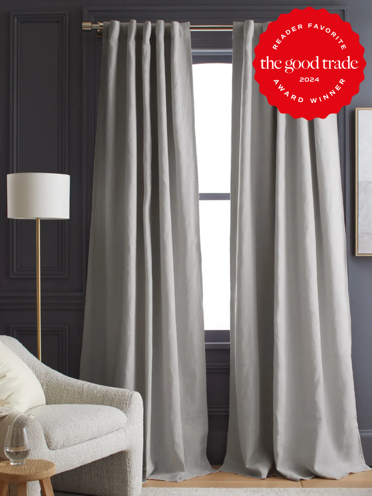 A grey curtains in a room.