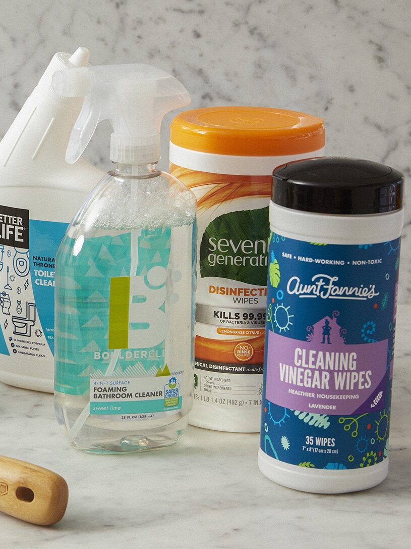 A variety of eco-friendly cleaning supplies on a kitchen countertop.