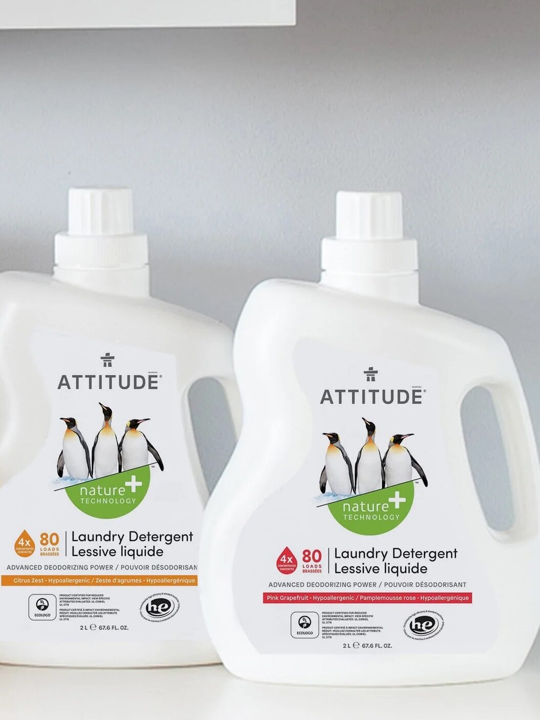 Two bottles of attitude nature+ laundry detergent displayed on a shelf, highlighting different available scents.