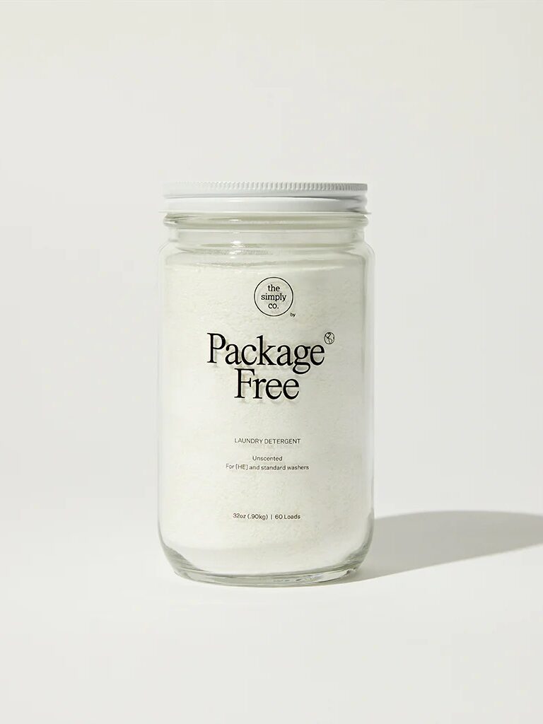 A jar of package-free laundry detergent against a plain background.
