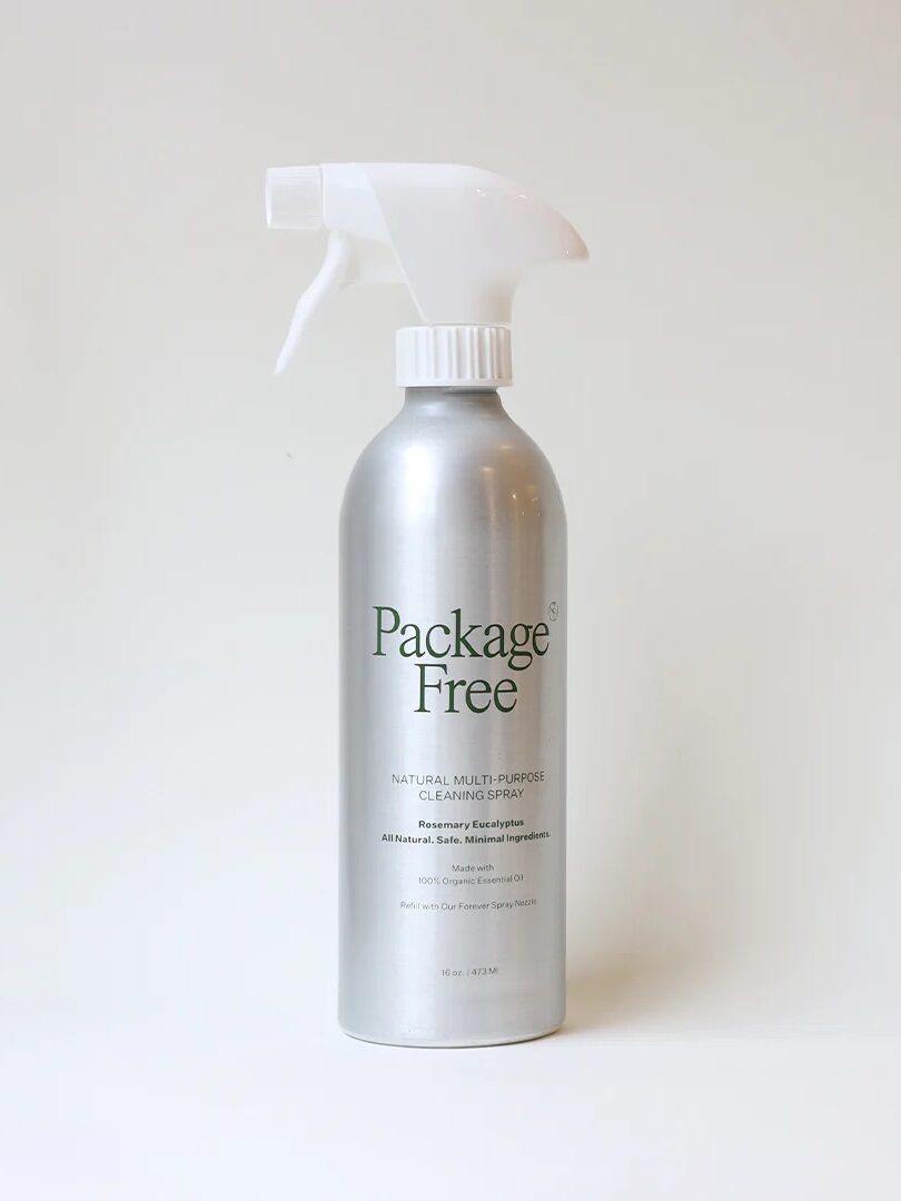 A spray bottle labeled "package free natural multi-purpose cleaner" against a plain background.