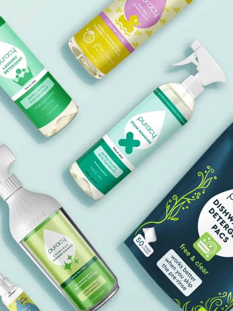 An array of eco-friendly cleaning products in various packages displayed on a teal background.