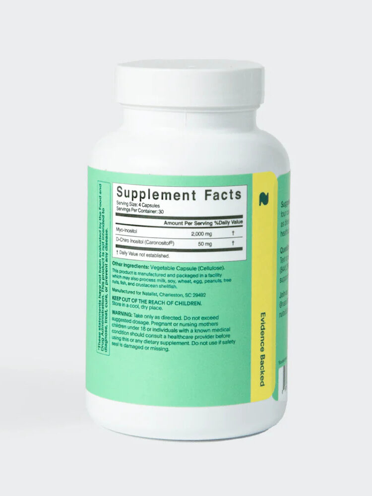 A white supplement bottle with a green label displaying nutritional information on a light gray background.