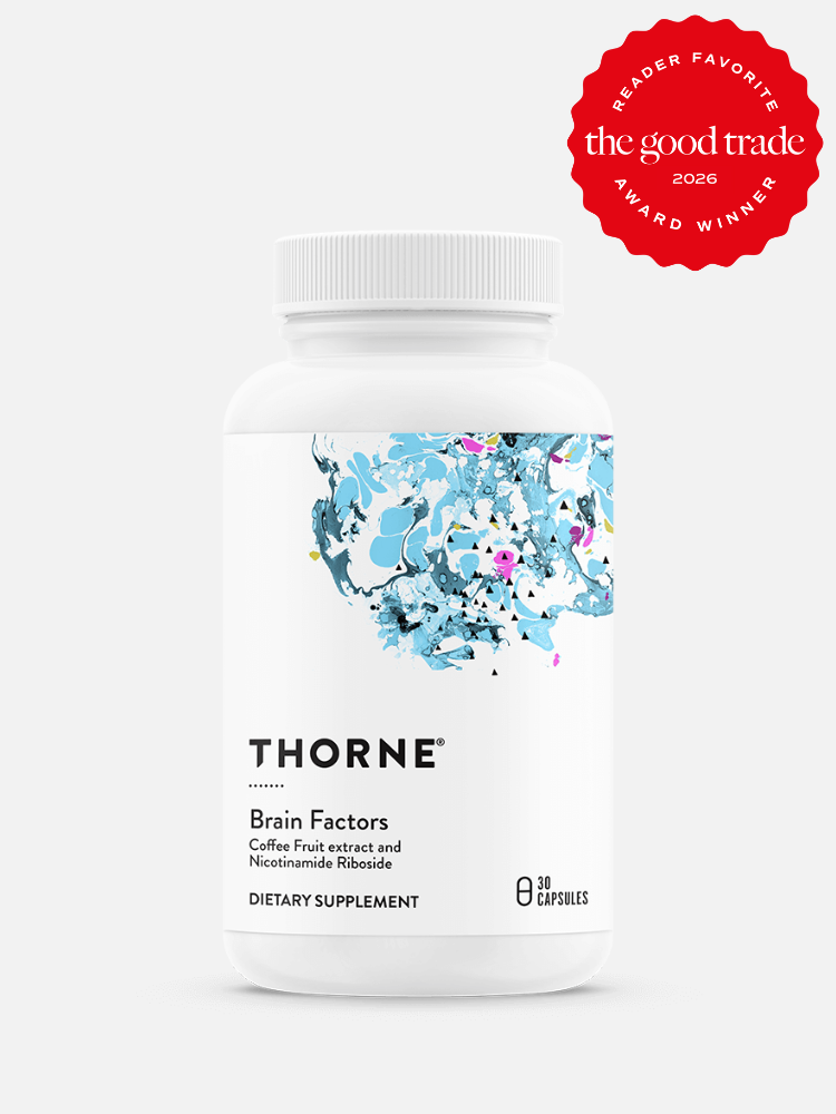 A white bottle of Thorne Brain Factors dietary supplement with abstract blue artwork on the label; 30 capsules. A red "The Good Trade" reader favorite award badge is displayed in the top right.