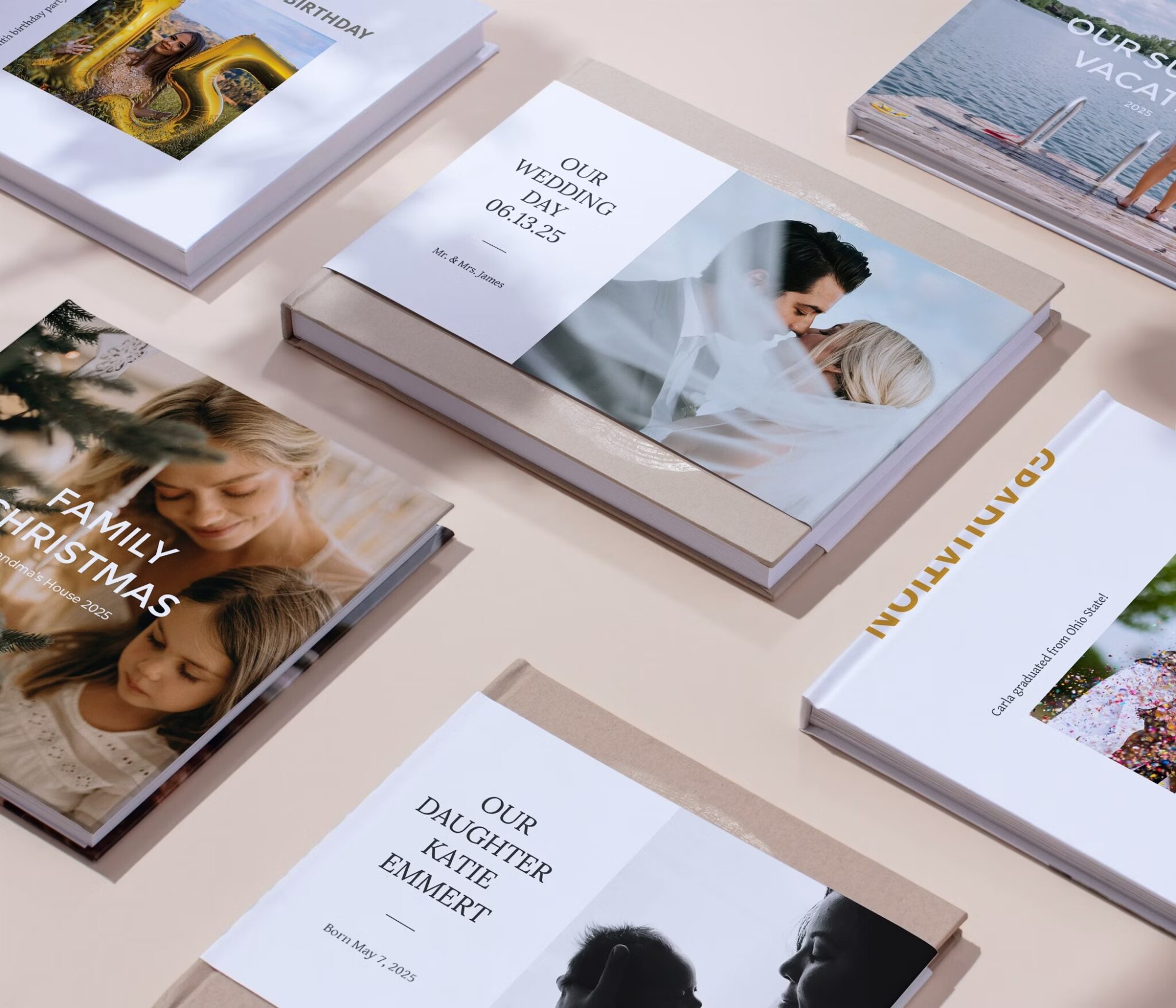 A variety of personalized photo books with different cover images and titles are arranged on a light surface.