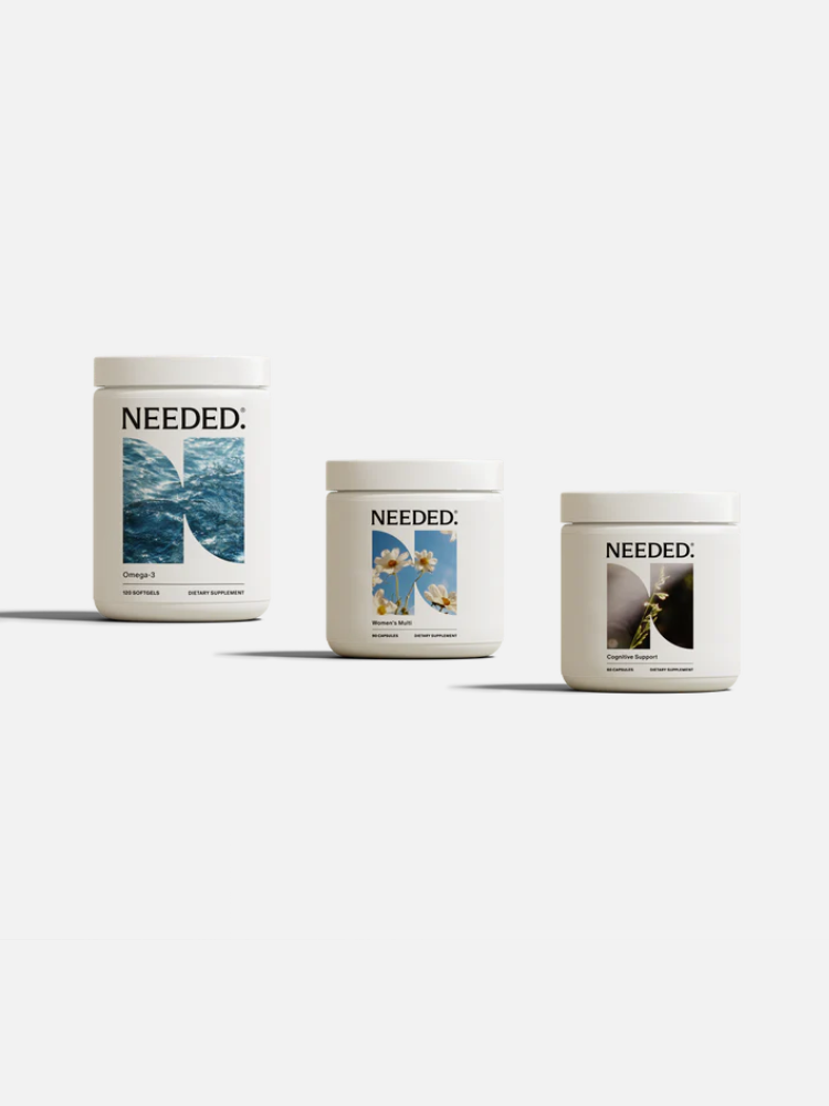 Three white supplement containers labeled "NEEDED:" with different front label images—ocean waves, flowers, and a bee—are displayed on a plain white background.