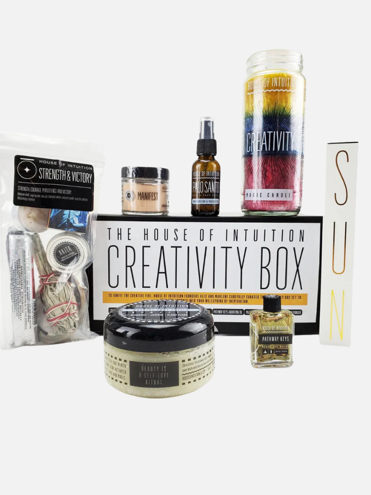 A collection of creativity-themed products including candles, oils, salts, and a booklet, all labeled from the House of Intuition Creativity Box, arranged against a white background.