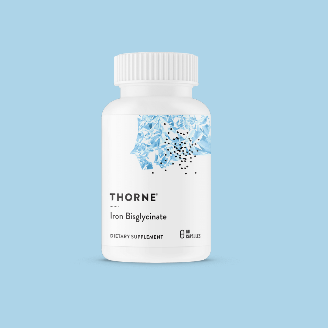 A white bottle labeled "Thorne Iron Bisglycinate" dietary supplement with a white cap, blue abstract design, and text indicating it contains 60 capsules.