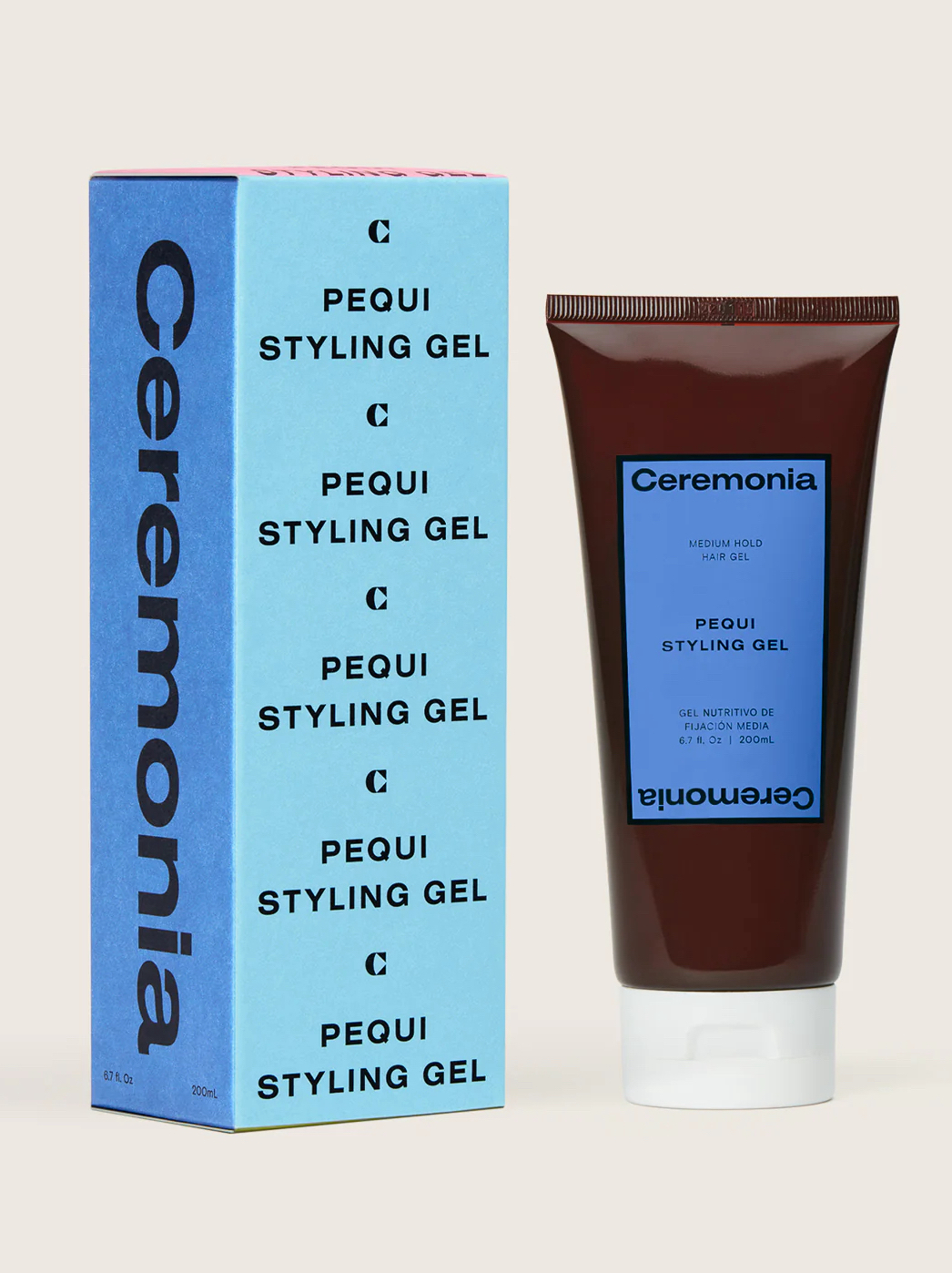 A tube of Ceremonia Pequi Styling Gel stands next to its blue product box, both labeled with the brand name and product details.