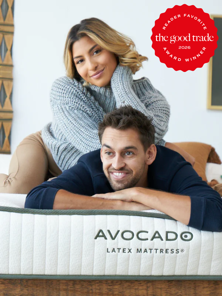 A man and woman lying on a mattress.