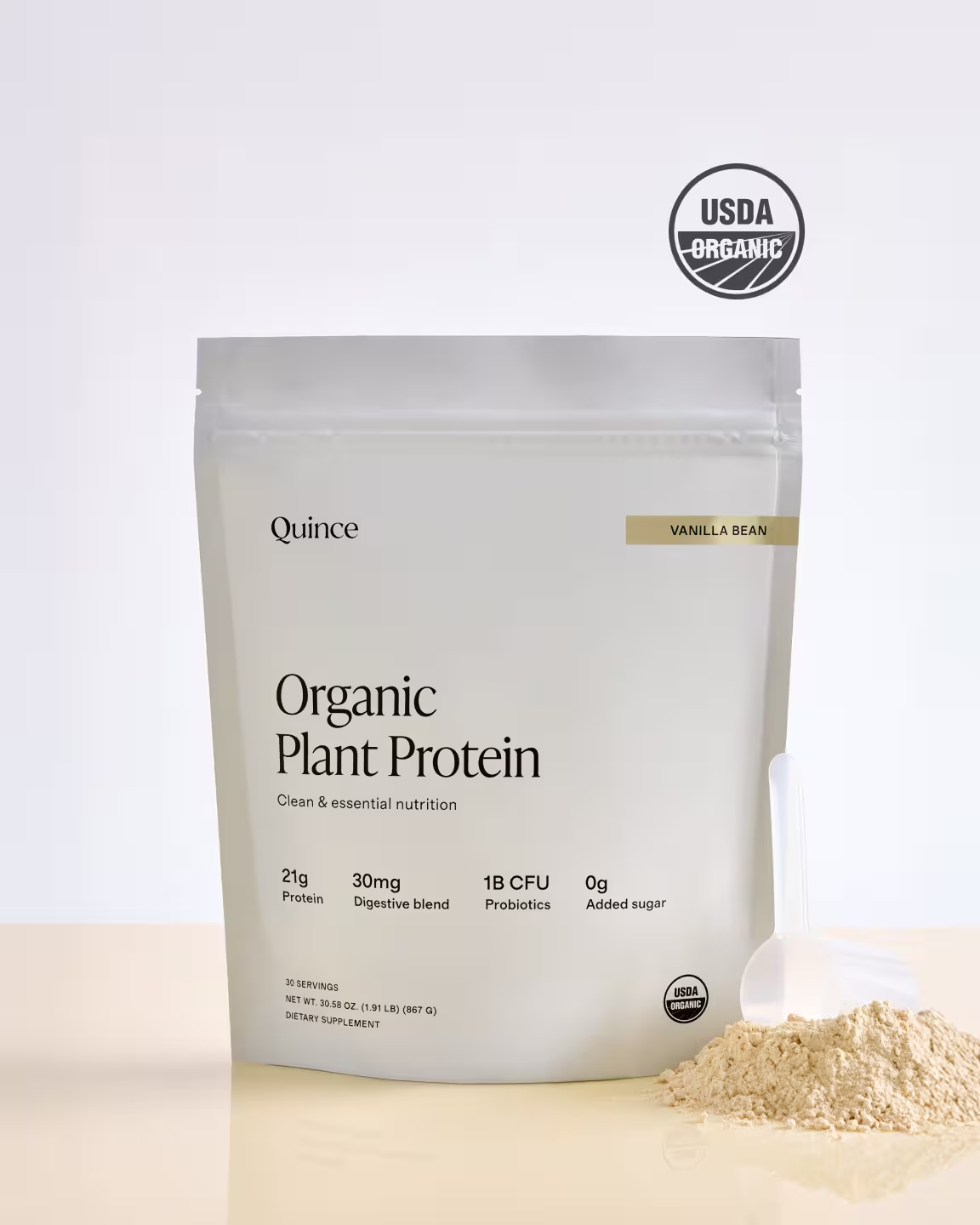 A pouch of Quince Organic Plant Protein powder, vanilla bean flavor, with a scoop of powder beside it. The packaging highlights key nutritional benefits and USDA Organic certification.