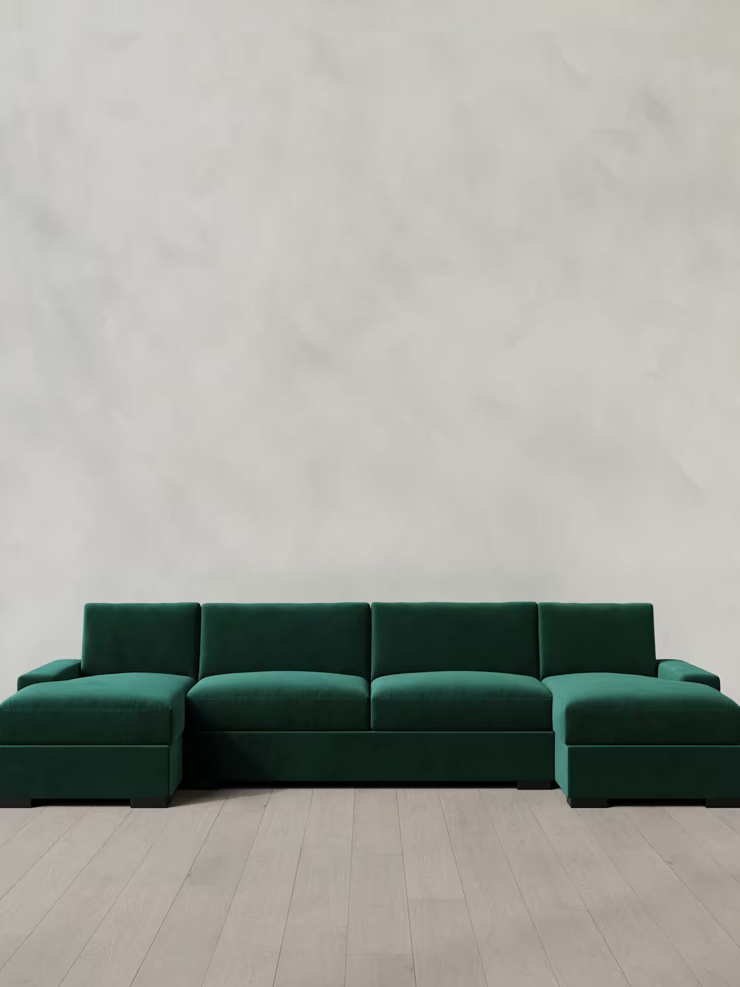 A green couch in a room.