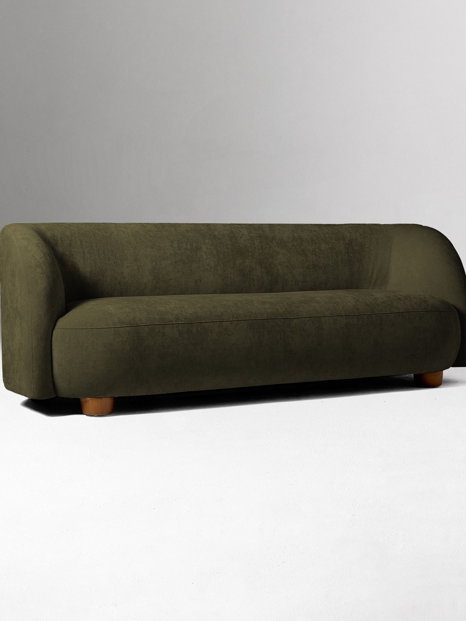 A modern olive green sofa with rounded edges and wooden legs, set against a plain white background.