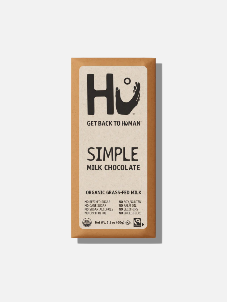 A Hu brand Simple Milk Chocolate bar with organic grass-fed milk, labeled as free from refined sugar, cane sugar, gluten, palm oil, lecithins, and emulsifiers. Net weight 2.1 oz (60g).