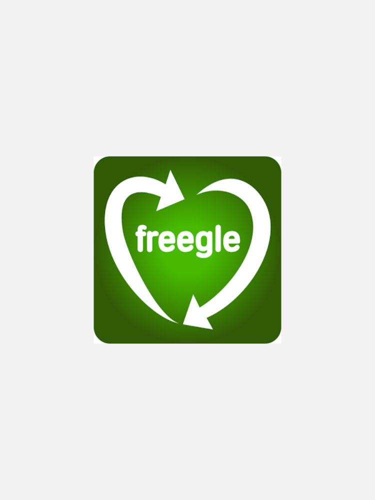 Green Freegle logo with two white arrows forming a heart shape around the word “freegle” on a green background.