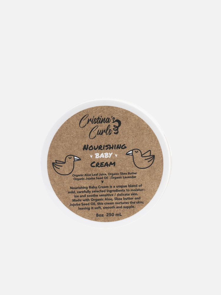 A round container labeled "Cristina's Curls Nourishing Baby Cream" with a brown label featuring two bird illustrations and product details.