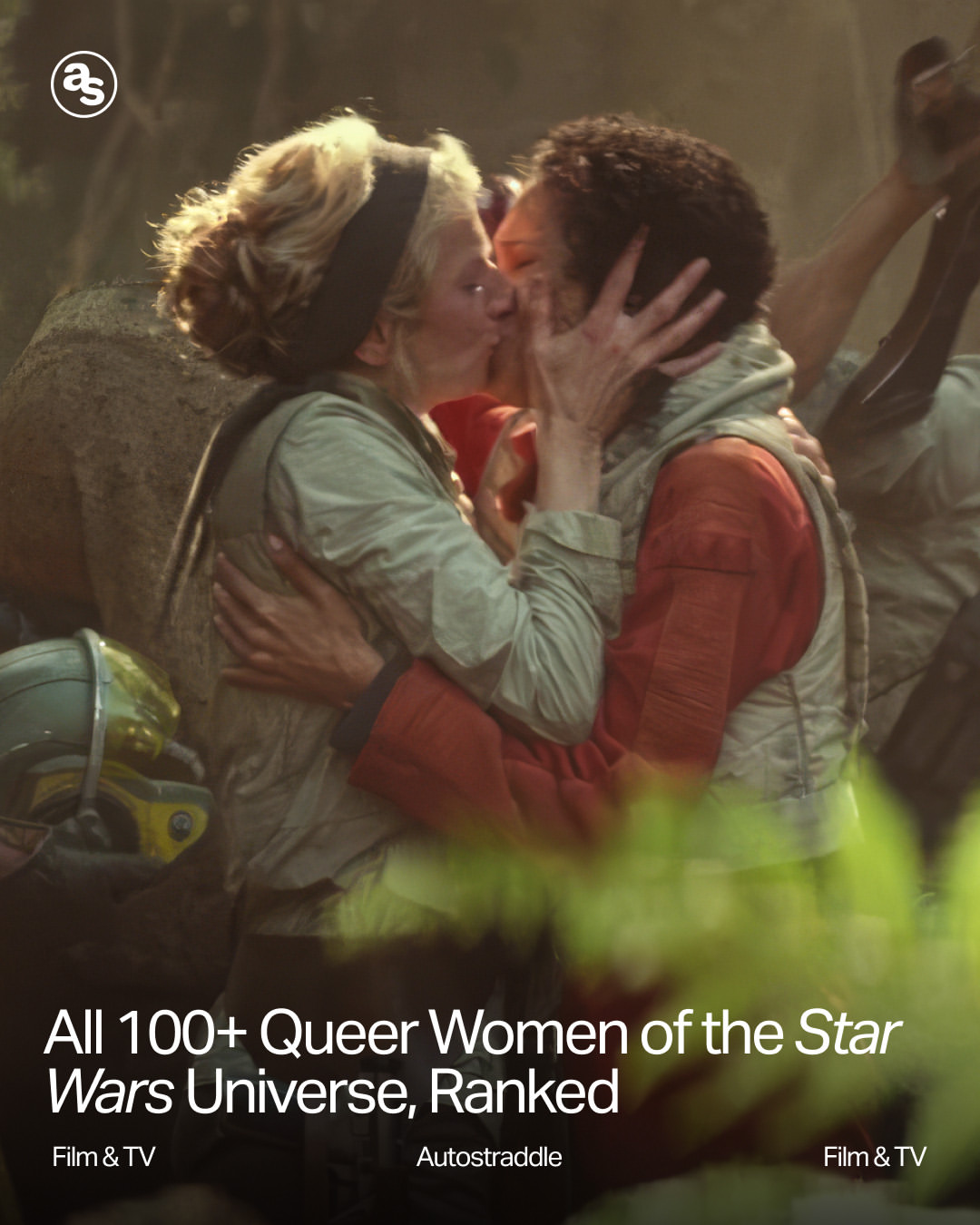 Two women in flight suits kiss while others in similar attire stand nearby in a forest setting. Text overlay reads: "All 100+ Queer Women of the Star Wars Universe, Ranked.