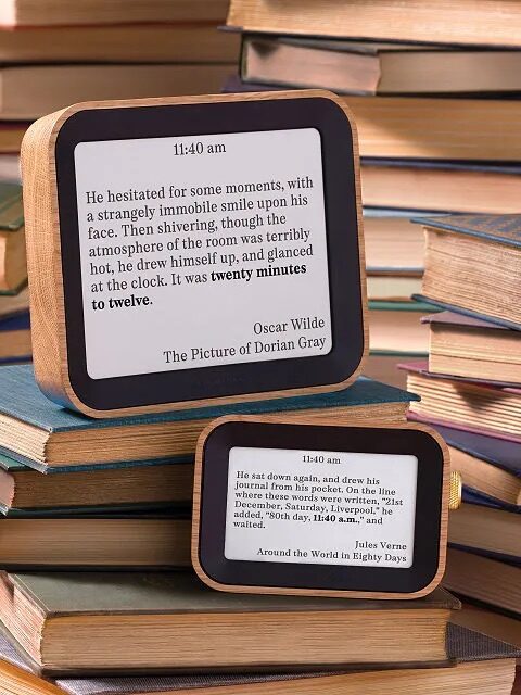 Two digital clocks display literary quotes with the current time from classic novels, surrounded by stacks of assorted books—perfect inspiration for your next online shopping adventure.