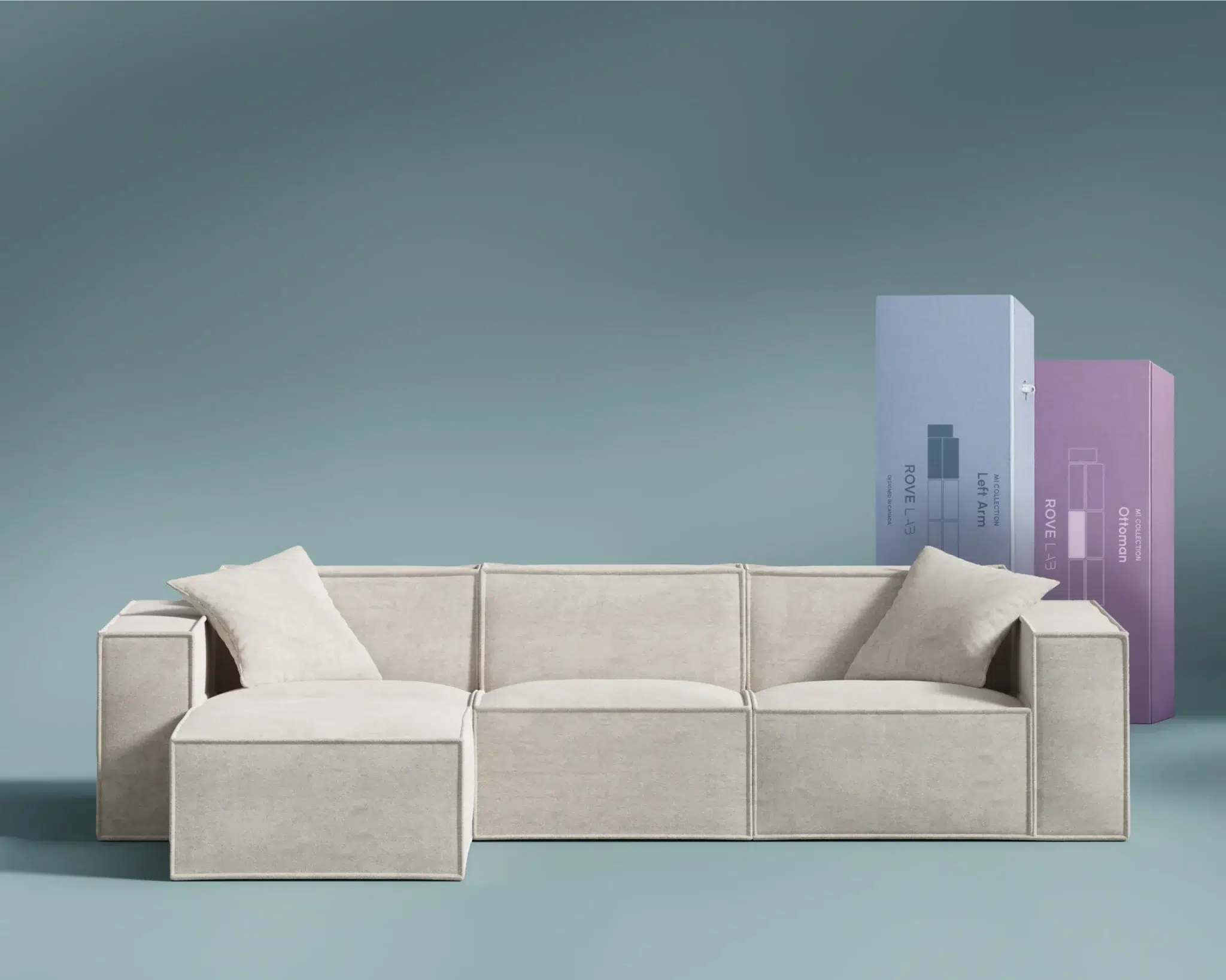 A light beige modular sofa with two cushions is in front of tall blue and purple rectangular boxes on a solid light blue background.
