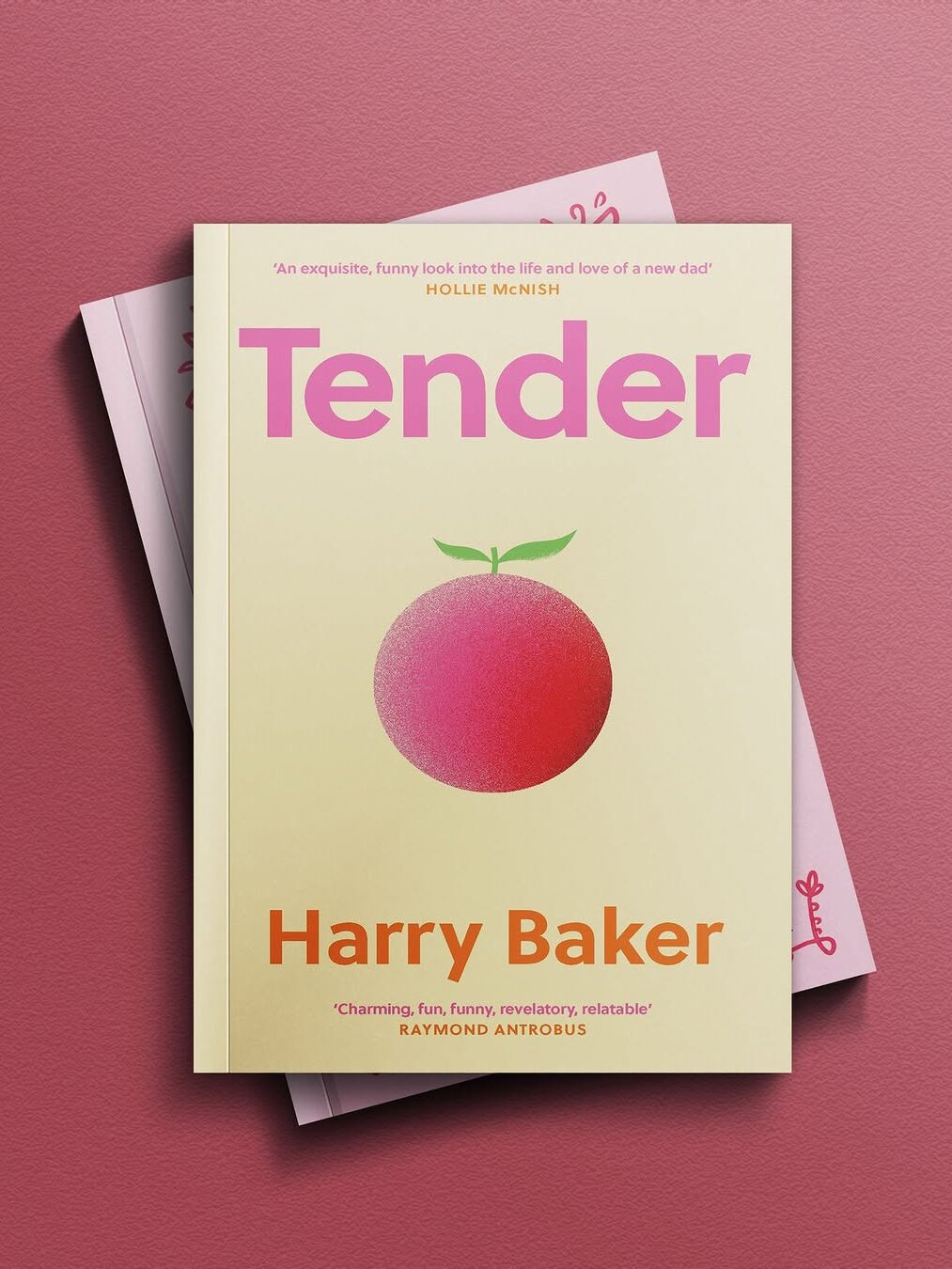The book "Tender" by Harry Baker is displayed on top of another book, featuring a large pink-orange fruit illustration on a yellow cover.