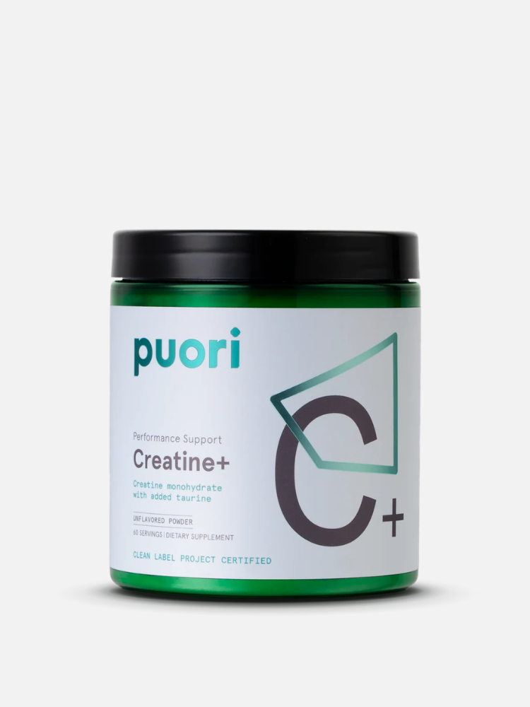 A green and white container of Puori Creatine+ dietary supplement with black lid, showing product name and details on the label.