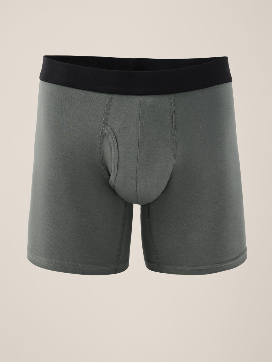 Gray men's boxer briefs with a black waistband, shown against a plain light background, positioned facing forward.
