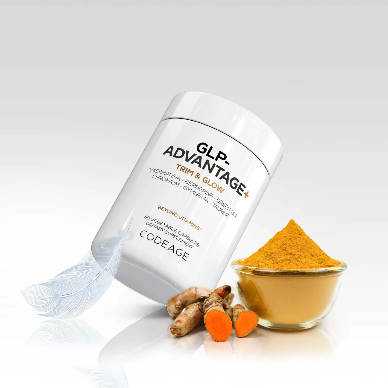 A bottle labeled "GLP Advantage+ Trim & Glow" by Codeage is shown next to turmeric roots, a bowl of turmeric powder, and a white feather on a white background.
