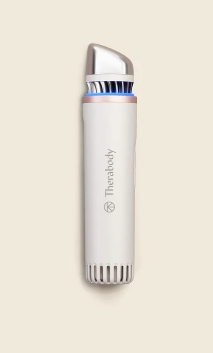 A vertical Therabody TheraFace mask device in white and silver.